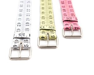 Belts made of upcycled yellow coral pink white black tape measure sewn on cotton base recycling repurposed reclaimed