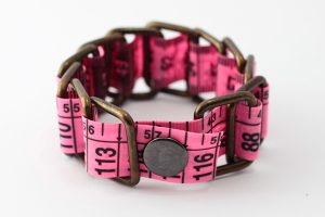 Fluorescent measuring tape bracelet upcycled reclaimed repurposed intertwined metal chains