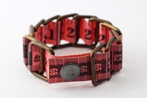 coral pink measuring tape bracelet upcycled reclaimed repurposed intertwined metal chains