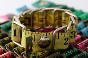 Yellow measuring tape bracelet upcycled reclaimed repurposed intertwined metal chains